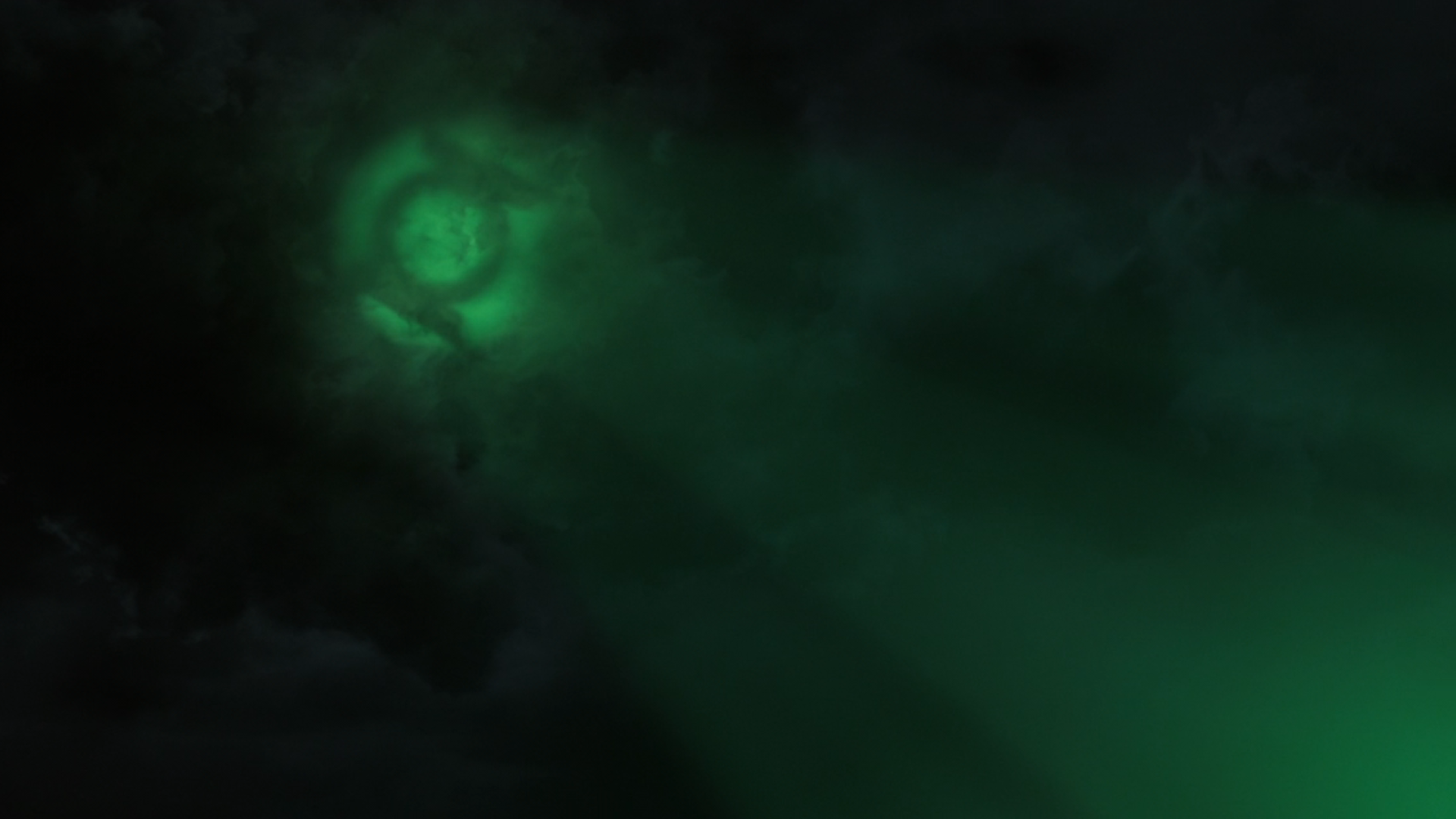 A Light Signal In The Sky Of The Green Lantern Logo.