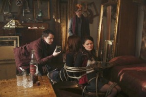 Ariel (Joanna Garcia Swisher) and Belle (Emilie De Ravin) are tied up by two men working for Pan in Gold's shop.