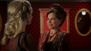Barbara Hershey returns as Cora/the Queen of Hearts. In the past, she befriends Anastasia/the Red Queen.